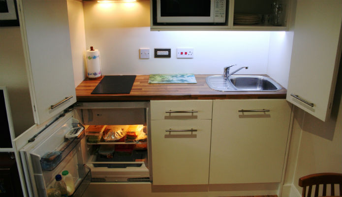 Hidden compact kitchen with fridge with a granny annexe