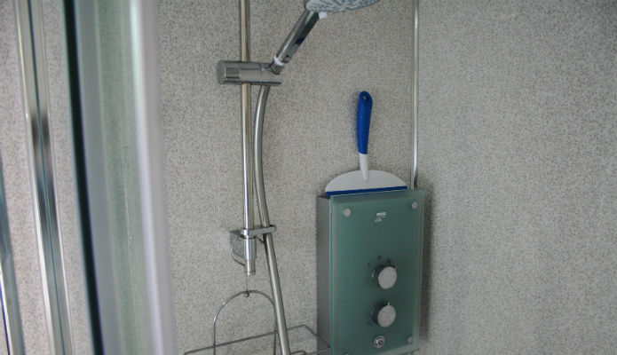 Interior of granny annexe shower with large cubicle