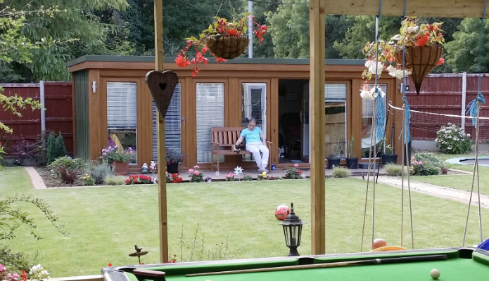 Irene Stroking Her Cat Whilst Relaxing Outside her Granny Annexe